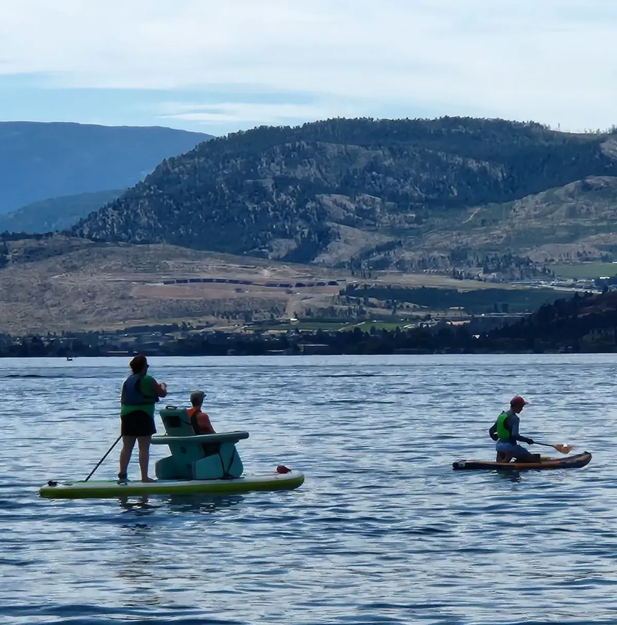 Me paddlboarding on Lake Okanagan with my parents, and my brother.