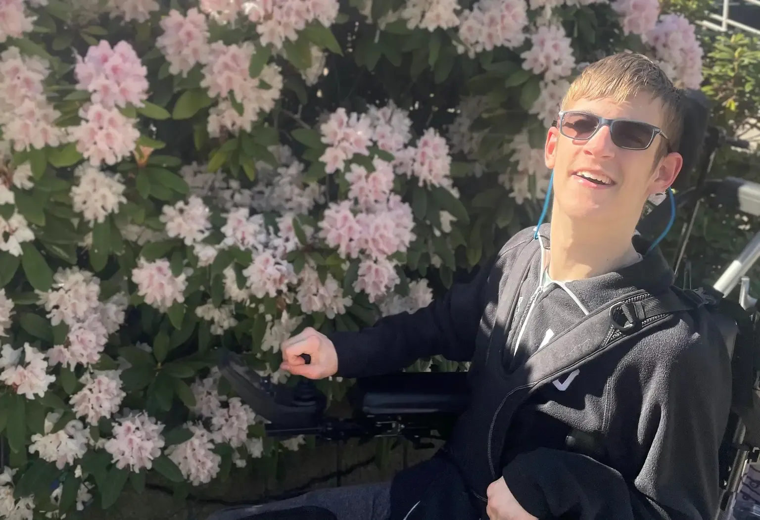 Me in front of some flowers at Vancouver Island University